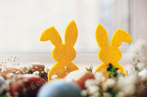 Preview: Natural dyed easter eggs and rabbit decorations on wooden background