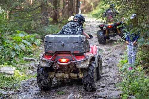 Preview: ATV on the mountain road in forest causing erosion problem for environment
