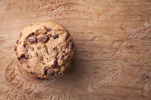 Preview: Cookies with chocolate chips on a wooden table. Top view with copy space