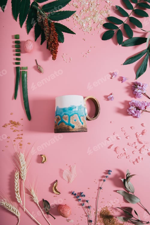 Preview: Top view of cup mock up on pastel millennial pink paper background copy space.