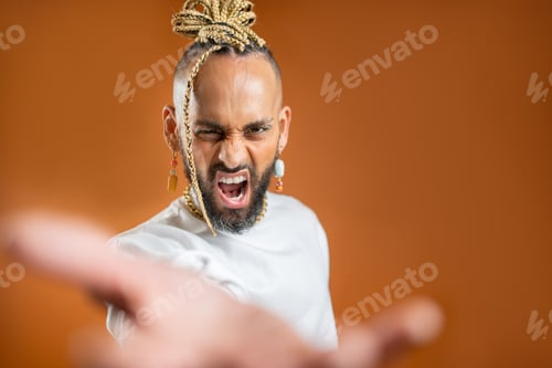 Preview: Black latin gay man outstretching empty hand towards camera