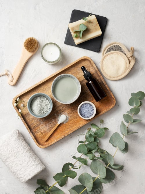 Vista previa: the concept of organic cosmetics with clay, sea salt, soap, brush and eucalyptus branch