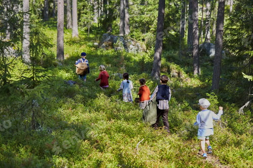 Preview: Six boys and girls dressed in retro clothing walking in forest