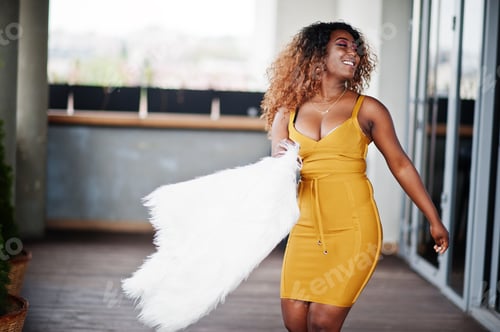 Preview: African american woman in yellow dress