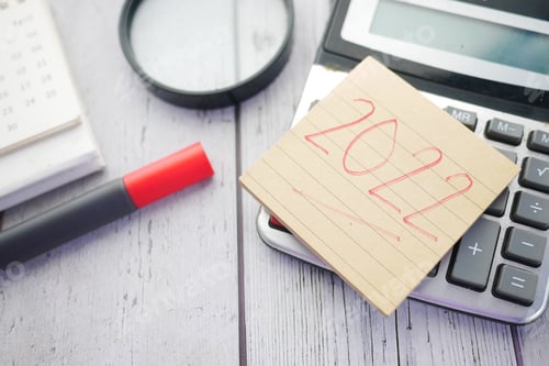 Preview: 2020 new year goals text on sticky note and stationary on table