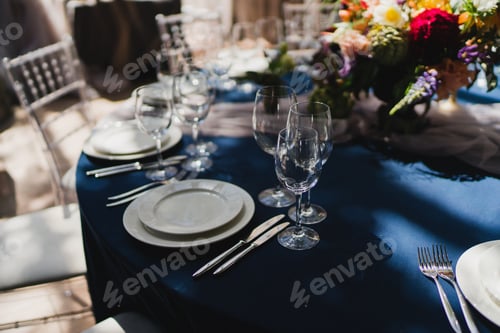 Preview: Table setting at the wedding reception. Floral compositions with beautiful flowers and greenery, can