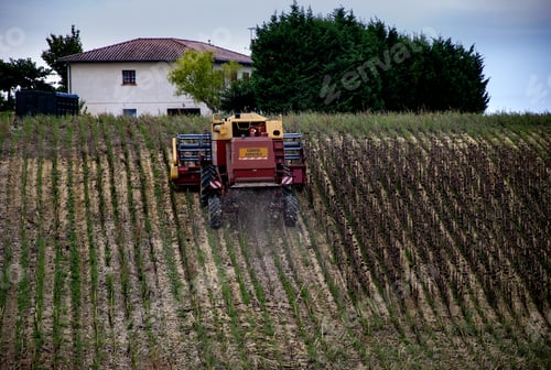 Preview: Combine harvester type vehicle with 'Convoi Agricole' which is a warning to the following traffic