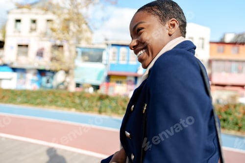 Preview: Young urban african woman walking in the city