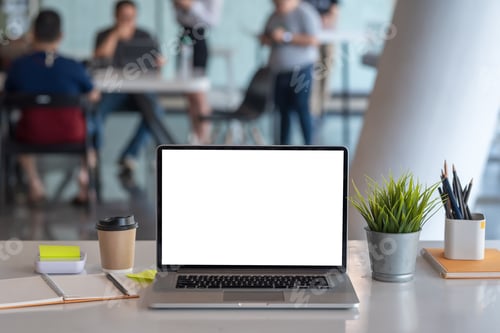 Preview: Laptop blank white screen placed at the office. Mock up.