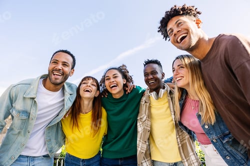 Preview: Young group of people having fun together outdoors in a sunny day