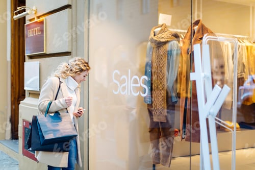 Preview: Curious shopper glances at a store sale
