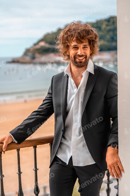 Preview: Street style with a young brunette caucasian man in a black suit
