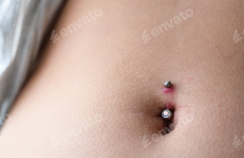 Close Up of Navel with Jewelry Piercing
