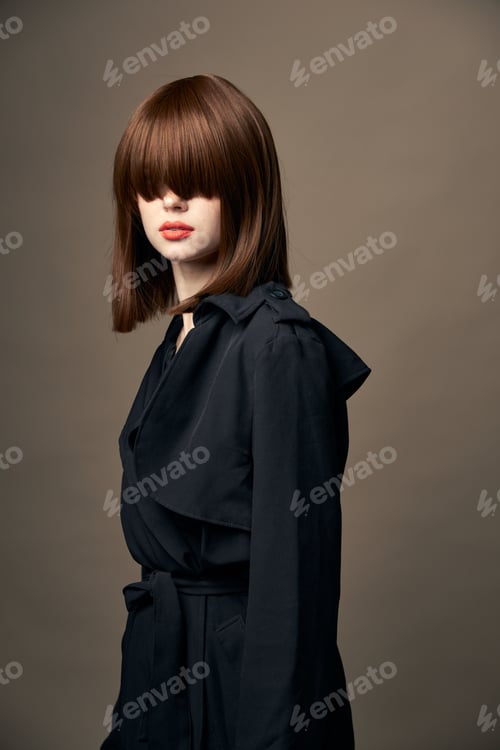 Preview: Funny lady classic coat bright makeup laughing on an isolated background