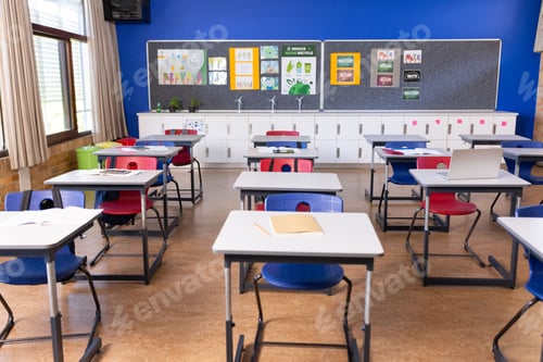 Preview: Empty classroom with desks and chairs neatly arranged, ready for students, copy space