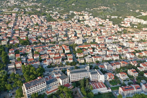 Preview: Drone view of Makarska covered in buildings and trees under the sunlight in Croatia