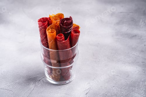 Preview: Fruit pastille in glass cup on stone concrete background