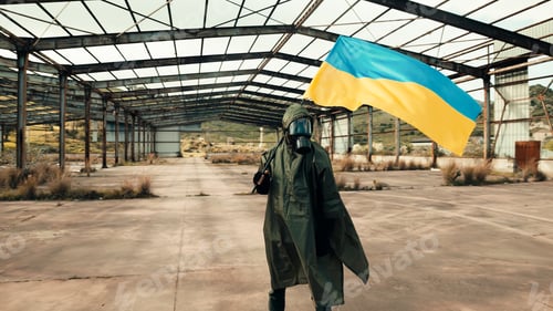 Preview: Ukrainian flag carried on the shoulder in the middle of the rubble