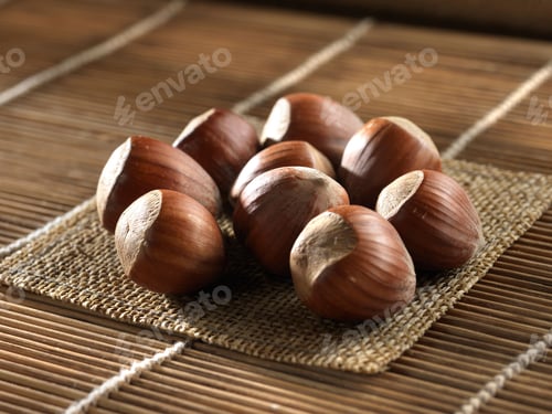 Preview: Plaid placemat with a pile of roasted chestnuts resting on top.