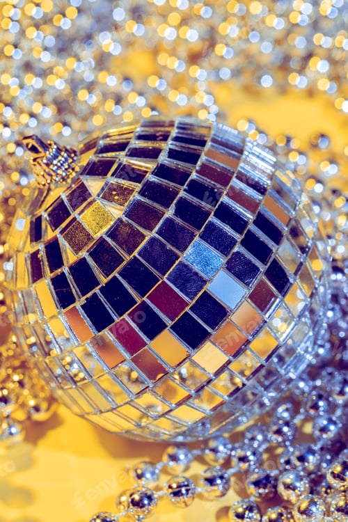 Preview: disco ball concept. Isolated on yellow background