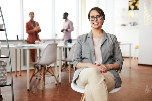 Preview: Smiling Businesswoman Sitting on Chair
