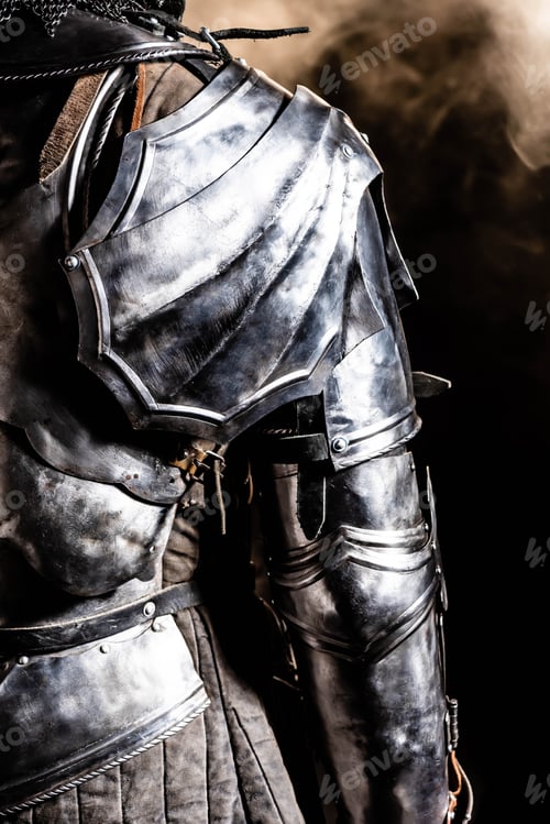 Preview: cropped view of knight in armor on black background