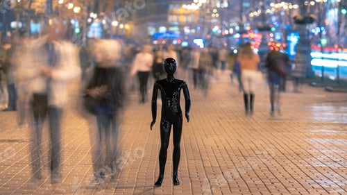 Preview: The mannequin stands on the street among the stream of people