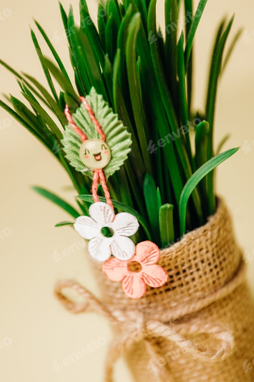 Preview: One beautiful flower martisor on sprouted wheat in a pot.
