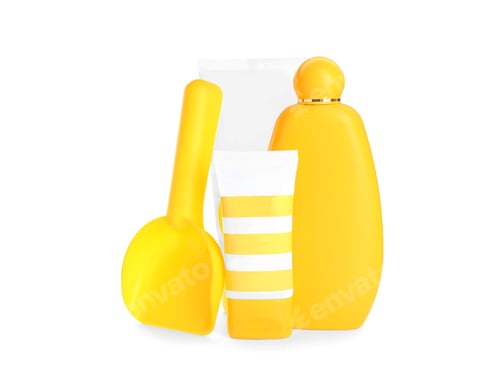 Preview: Different suntan products and plastic beach toy on white background
