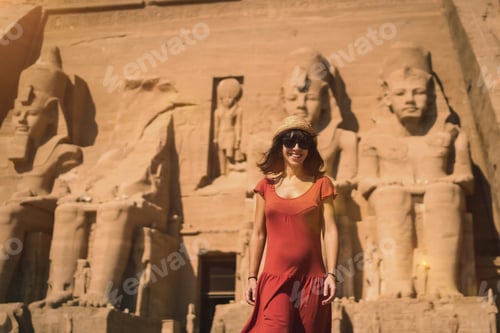 Preview: A young tourist in red dress at the Abu Simbel Temple in southern Egypt in Nubia