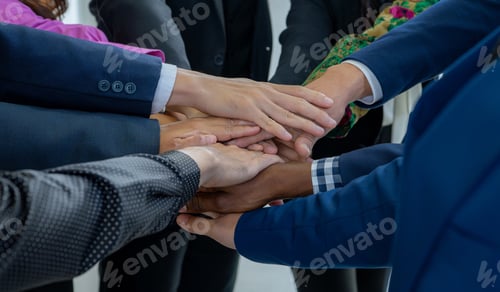 Preview: Team, teamwork, and unity concept. Diverse team putting hands together. Group of diverse business