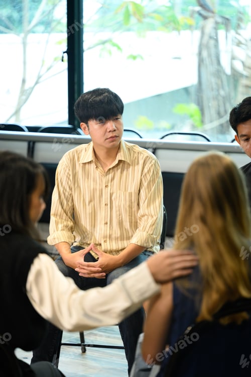 Preview: People attending a group therapy meeting, showing empathy and encouragement.