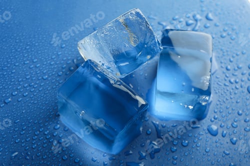 Preview: Ice cubes on wet blue background, close up