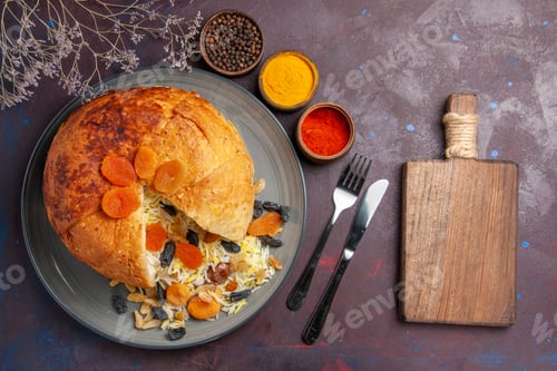 Preview: top view delicious shakh plov with raisins and different seasonings on dark background rice dough