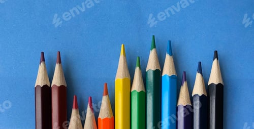 Preview: Coloured pencils on a blue background