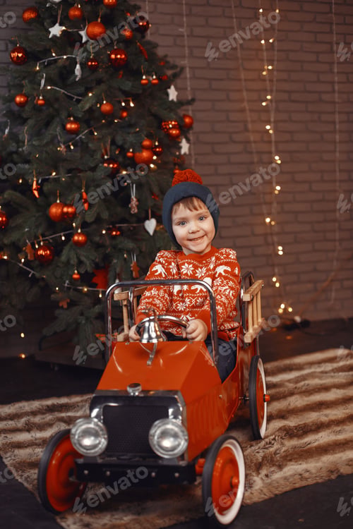 Preview: Cutte little boy at home near christmas decorations