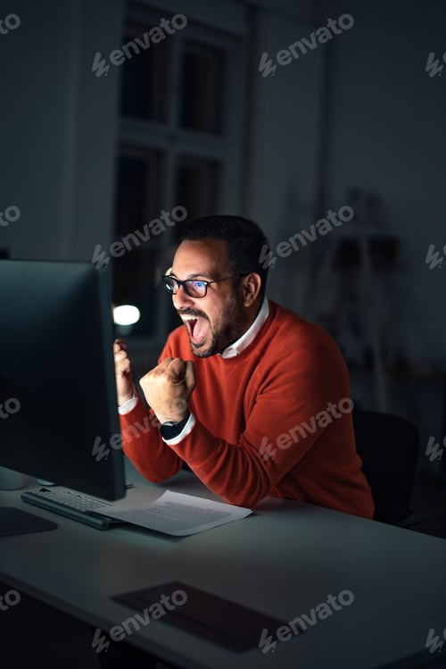 Preview: A man working overtime, looking successful, done all the company work.