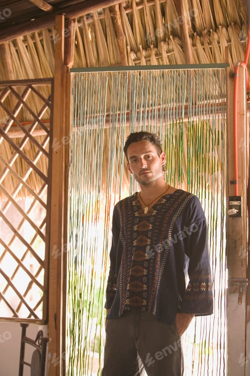 Preview: Young man standing in a doorway