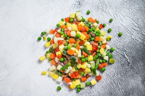 Preview: Frozen vegetables. broccoli, cherry tomatoes, corn, pea, carrot. White background. Top view