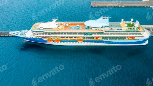 Preview: Aerial view of a luxury cruise ship or linear with a swimming pool on the roof moored in marina
