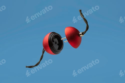 Preview: Red textured Christmas ball shaped like an electrical plug and socket, suspended in midair