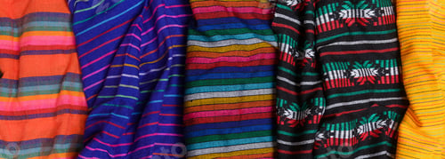 Preview: Colorful typical mexican tablecloths. Textile background, texture.