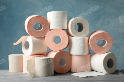 Preview: Many rolls of toilet paper against blue background