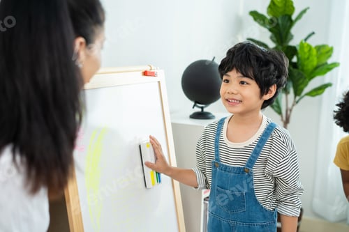 Preview: Caucasian beautiful young woman teacher teaching art to kids at school.