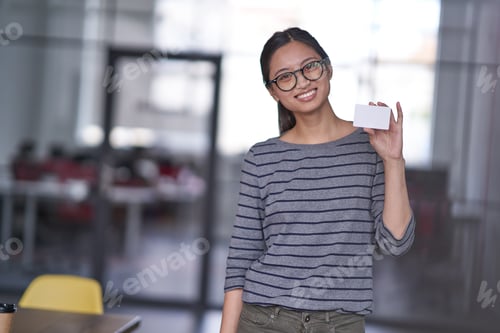 Preview: Beautiful woman holding and showing empty card