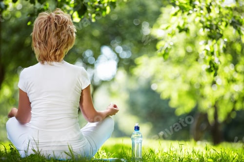 Preview: Woman Meditating in the Park on a Summer Day