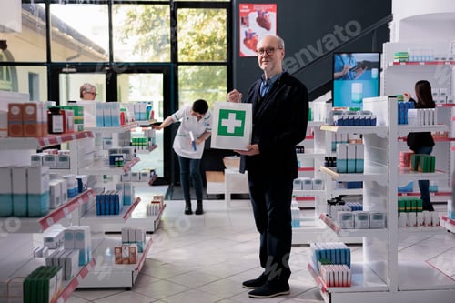 Preview: Elderly drugstore buyer standing with medicaments paper bag