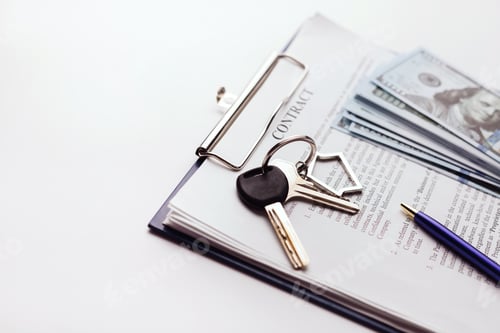 Preview: Real estate purchase contract with money and home keys on white table.