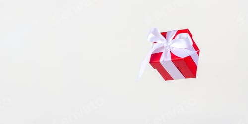Preview: Banner red gift box with white satin ribbon bow flying on white background.