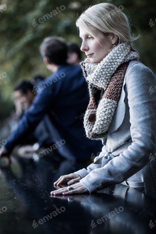 Preview: Sad woman looking at the Names of World Trade Center Memorial